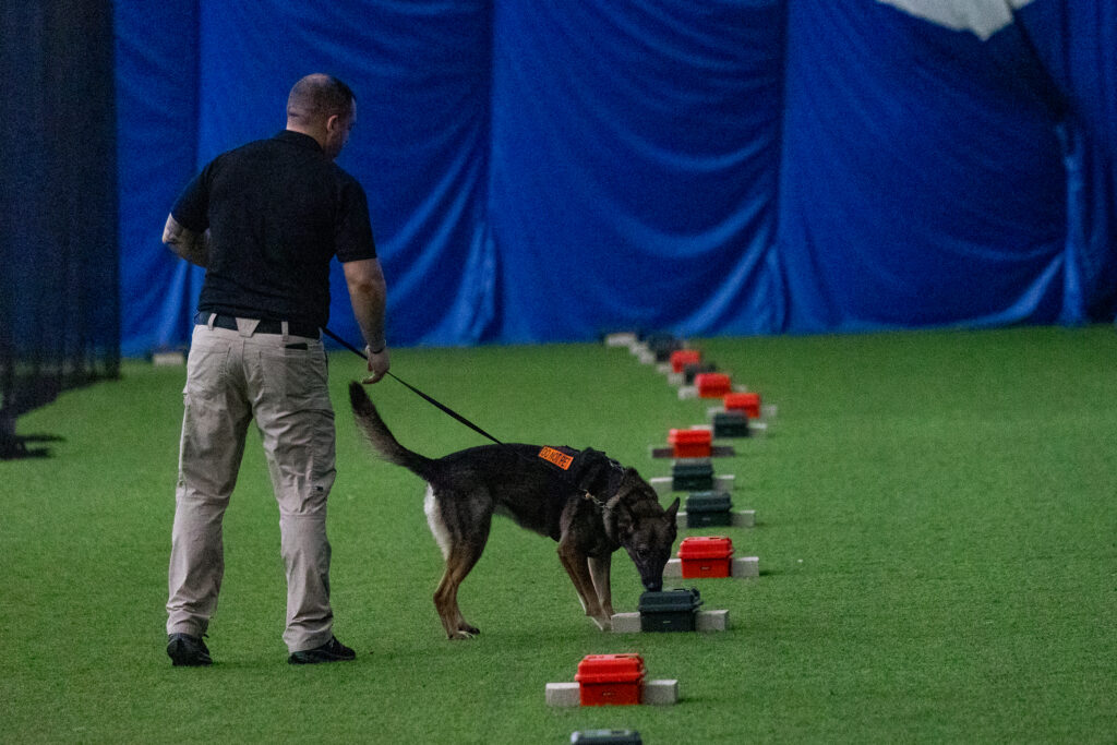 2023 WCCC Champion Justin Wolfshlag and K-9 Suzi photographed during the advance odor validation event.