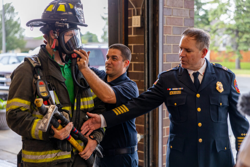 Chief Grzadziel explains the importance of a firefighter's equipment.